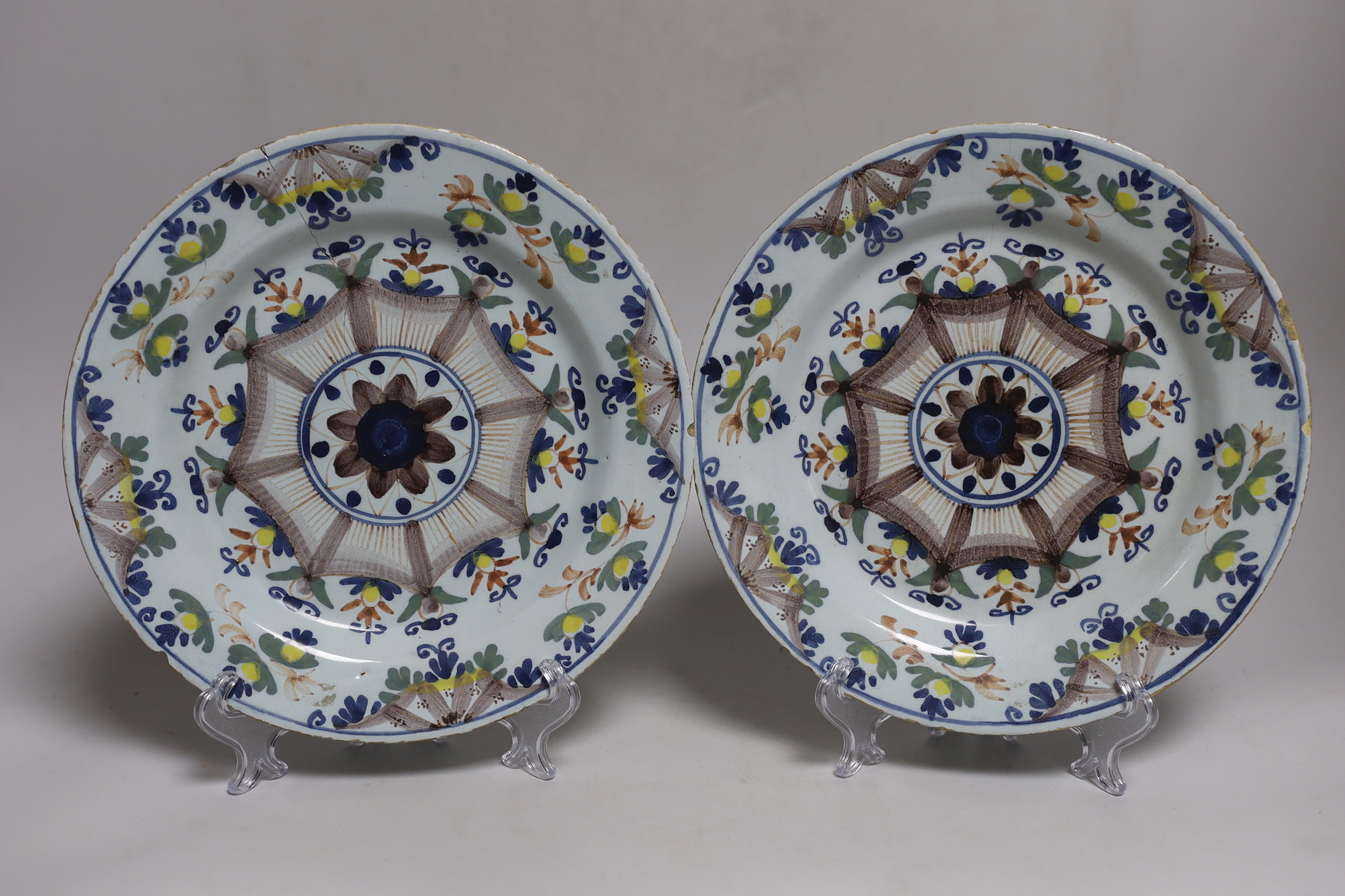 A pair of 18th-century English delftware polychrome plates, 23cm